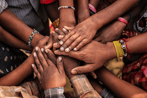 Hands holding South African Rand coins